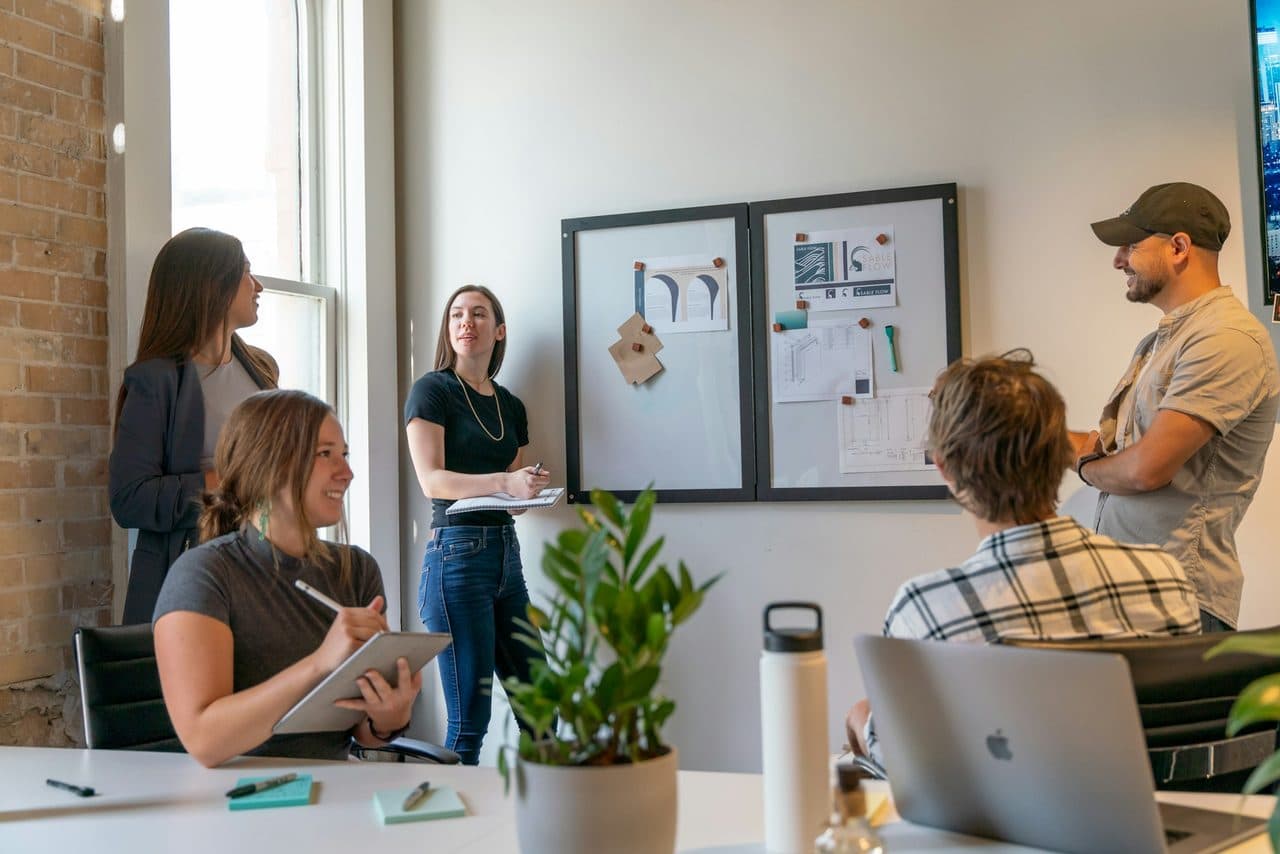 Multi-location operations team meeting in a modern office